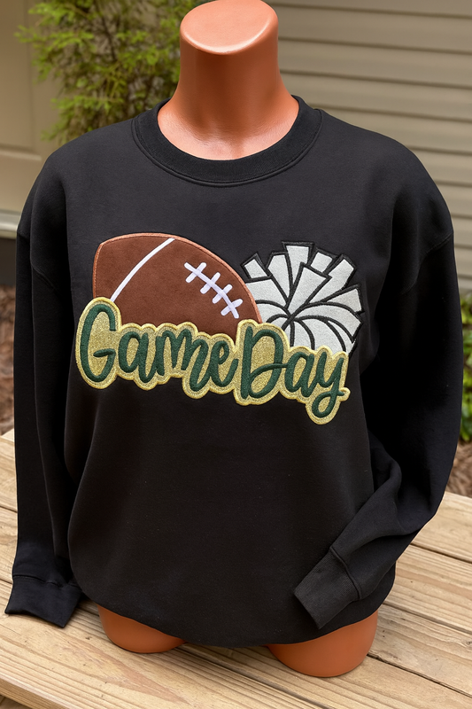 Black sweatshirt with 'Game Day' design featuring a football and pom poms on a mannequin.